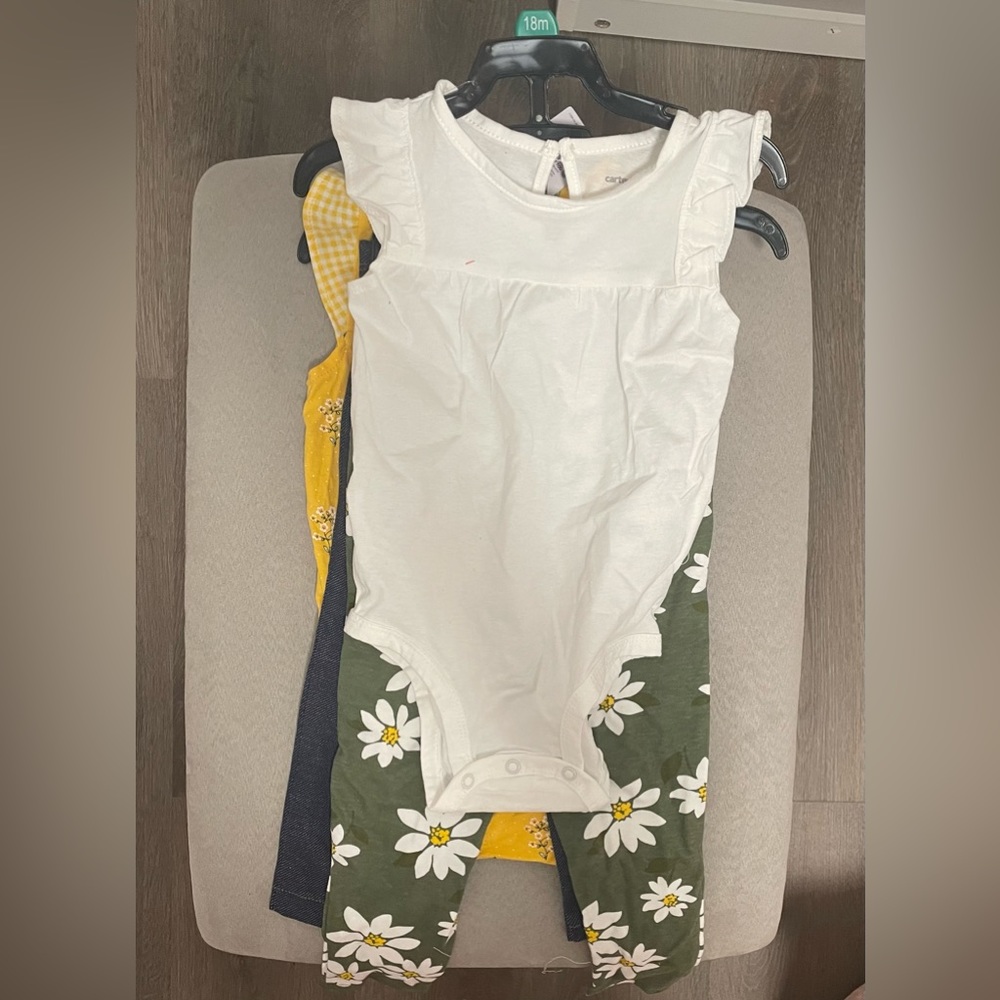 Four piece CARTER’S outfits (2 shirts - 2 pants)